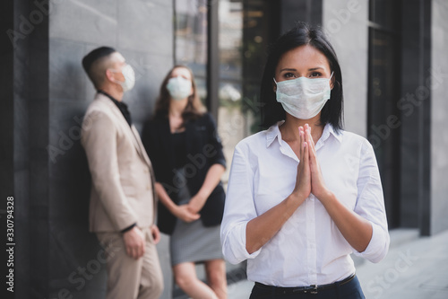 business people meeting with mask to prevent the spread of the virus covid-19