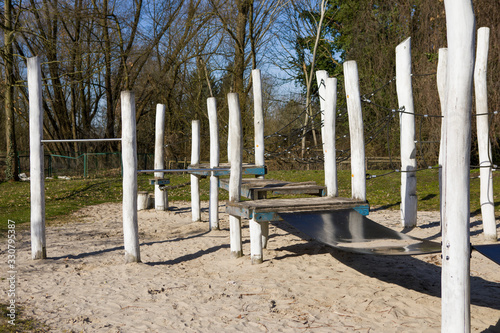 An empty playground with a swing in a natural environment