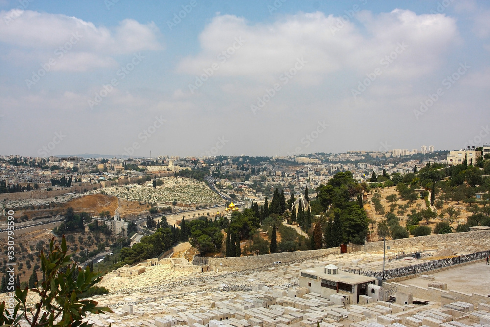 Mount of Olives and the old Jewish cemetery in Jerusalem, Israel. Panoramic view of the Old City, the Muslim Quarter and the Temple Mount, overlooking the Temple of Mary Magdalene
