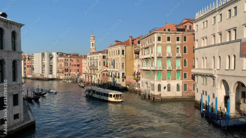 VENICE, ITALY - JANUARY 21, 2020. Boats in Venice Grand canal. Italy winter travel, bridge and houses. Romantic destination in Europe. VENICE, ITALY - JANUARY 21, 2020. Boats in Venice Grand canal. Italy winter travel, bridge and houses. Romantic destination in Europe.