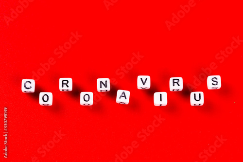 Pandemic and virus concept - Coronavirus word made of white blocks. Coronavirus text on red background.