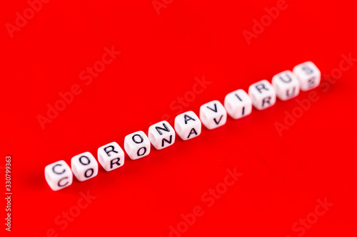 Pandemic and virus concept - Coronavirus word made of white blocks. Coronavirus text on red background.