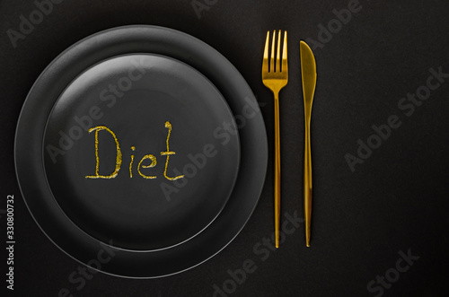 Lux diet. Black plate with gold appliances