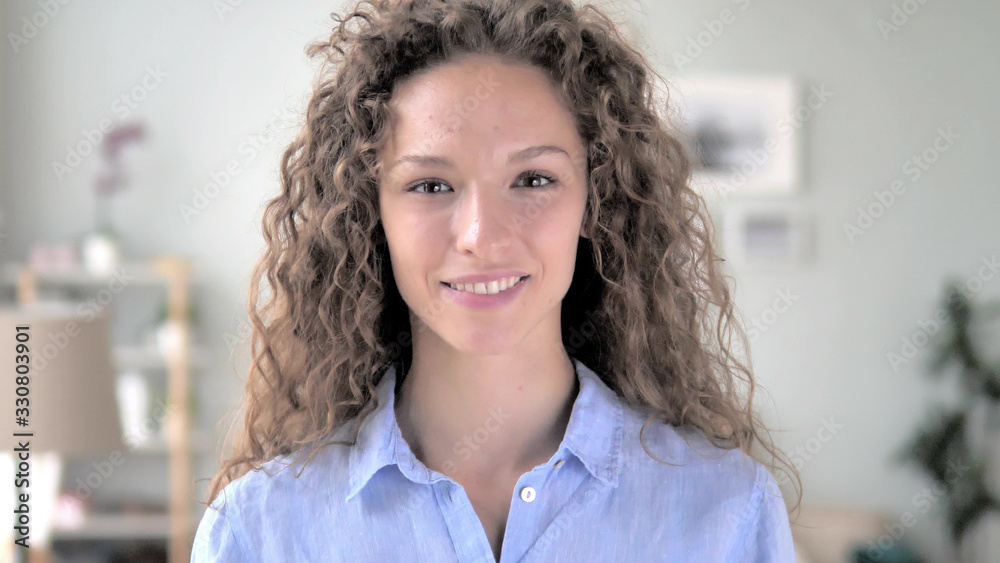 Portrait of Serious Curly Hair Woman Looking at Camera Portrait of Serious Curly Hair Woman Looking at Camera