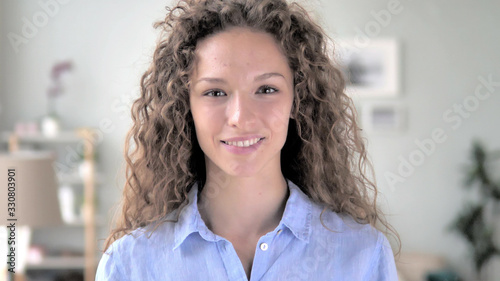 Portrait of Serious Curly Hair Woman Looking at Camera Free Download Portrait of Serious Curly Hair Woman Looking at Camera - GFXLoad