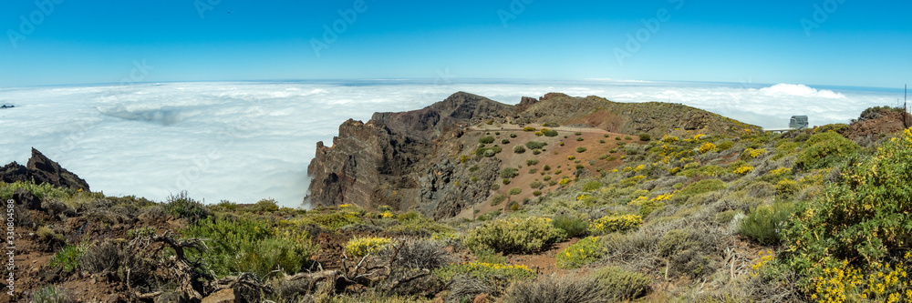 Fish eye Panorama of the National Park Caldera de Taburiente, volcanic crater seen from mountain peak of Roque de los Muchachos Viewpoint. Tenerife and El Hierro above the clouds. La Palma, Spain