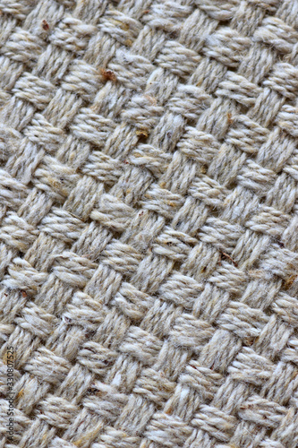 Woven natural fibers in diagonal pattern