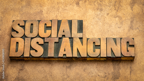 Fototapeta social distancing word abstract in wood type