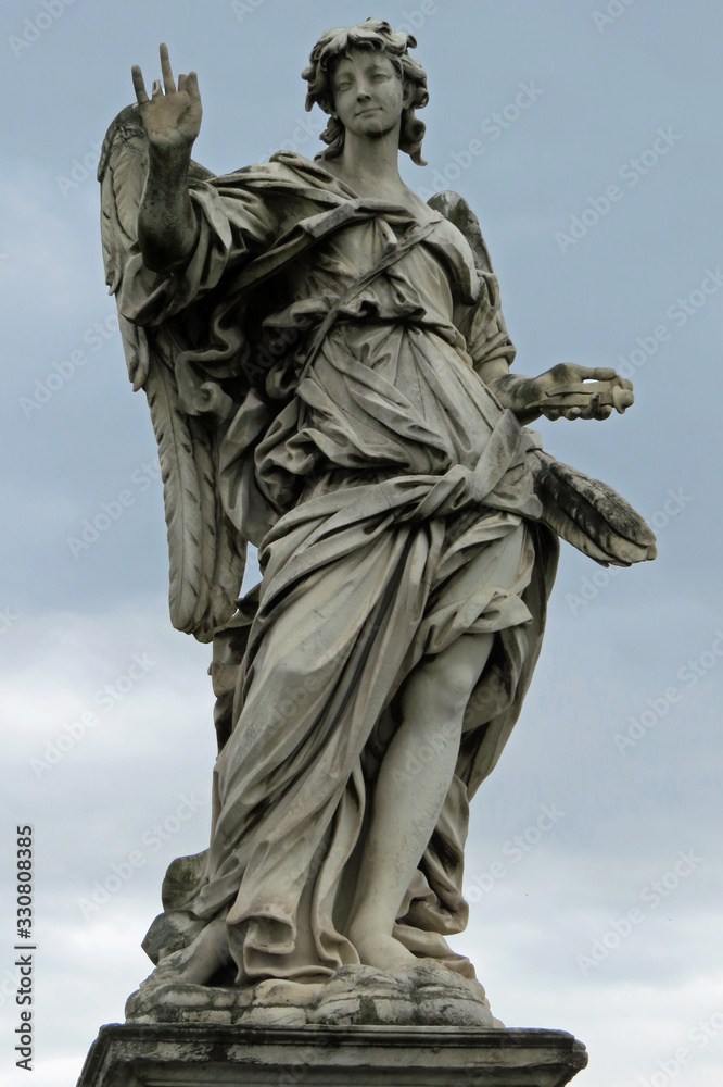 Statue of an angel on the bridge leading to the Castle of the Holy Angel (Castel Sant'Angelo); Rome, Italy, Europe