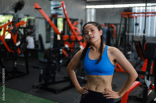 Asian woman in fitness gym