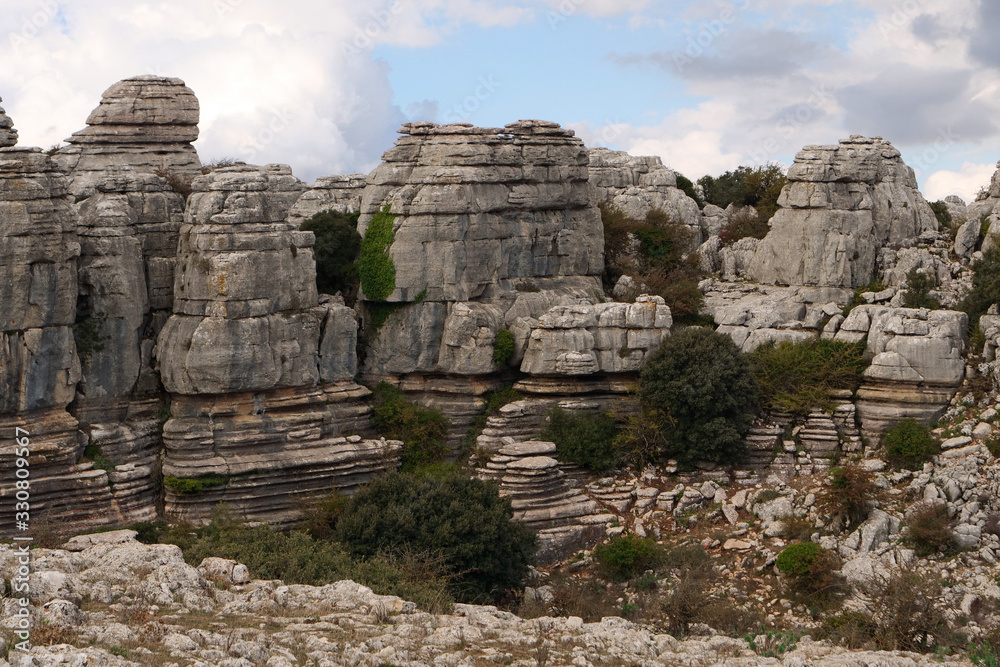 View on impressive stone formations in the beautiful karst landscape of El Torcal de Antequera at sunset, Spain, Europe