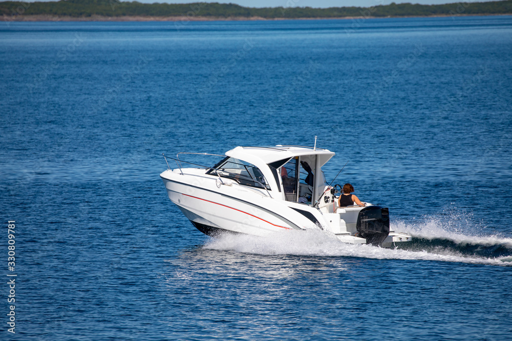 Fototapeta premium Leisure boat on sea a great summer day in Brønnøy municipality, Nordland county