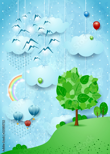 Fantastic landscape with big tree, flock of birds and rainbow