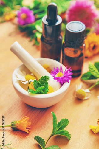 фотографія Homeopathy in small jars. Herbal extract. Selective focus.
