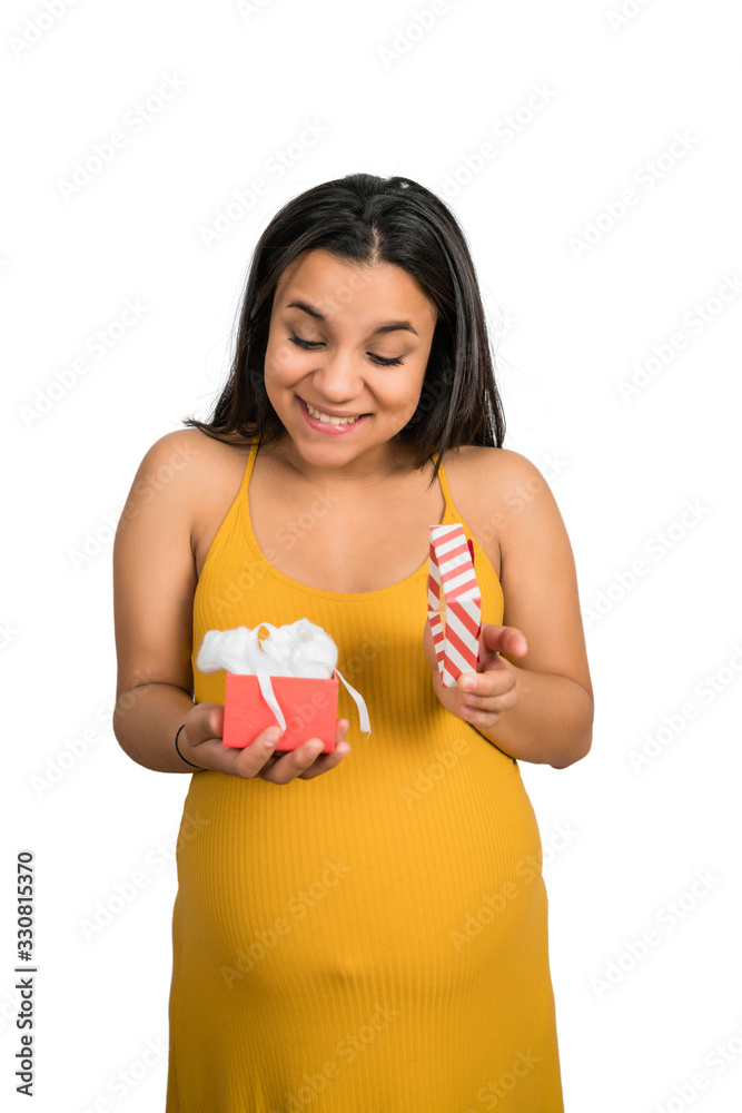 Pregnant woman holding and opening gift box.