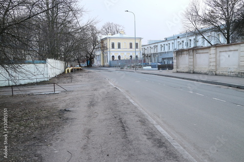 empty street on the outskirts of the city in spring