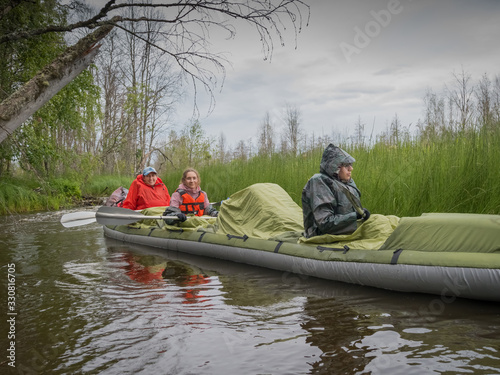 Rafting along a wild narrow river in Karelia. Ecotourism, visiting fragile, untouched natural areas