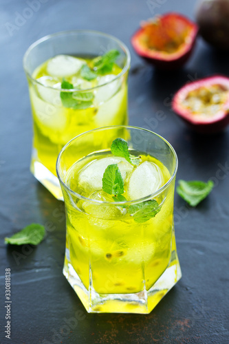 Cold drink with passion fruit and mint. Selective focus