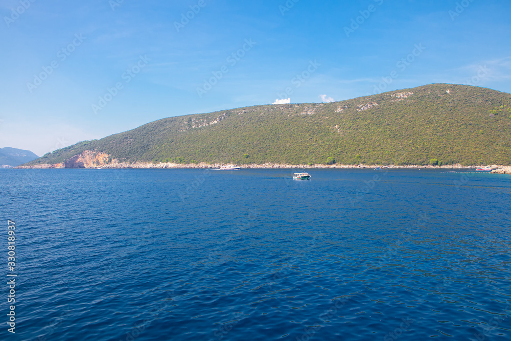 View of the Blue Bay and coastal hill