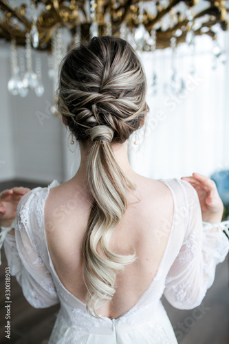 Wedding hairstyle of a beautiful girl close-up