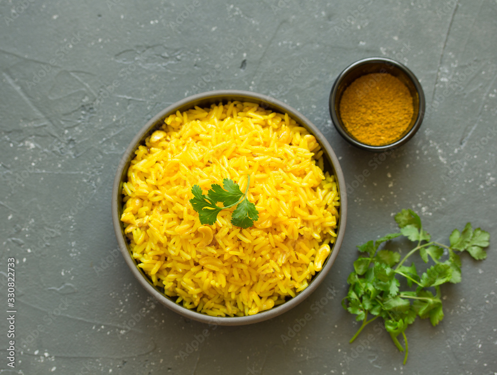 Vegetarian rice with curry and cashew nuts.