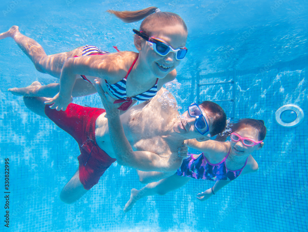 family  in swimming pool