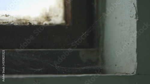 Spiderweb in a dirty window macro focus rack