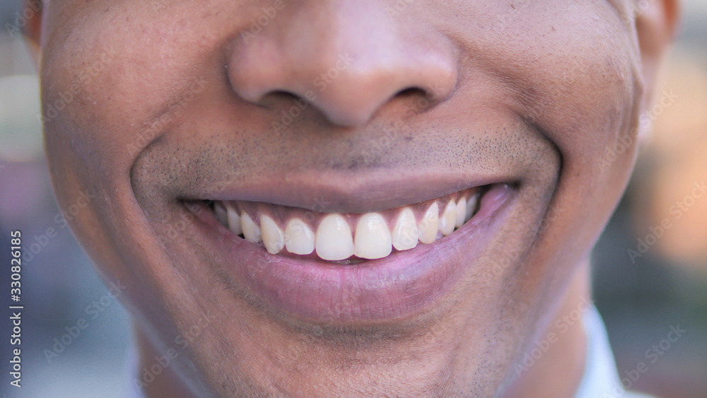 Close up of Smiling Young African Man Lips Close up of Smiling Young African Man Lips