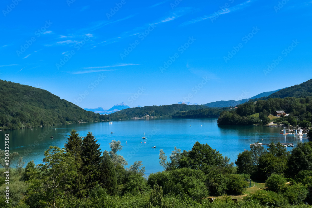 Natural landscape with a lake and mountains background