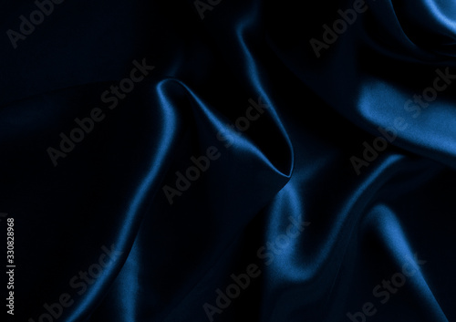 Satin blue silk background, close-up.
