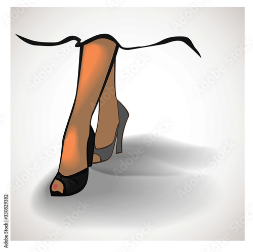 Woman's legs in high heeled shoes