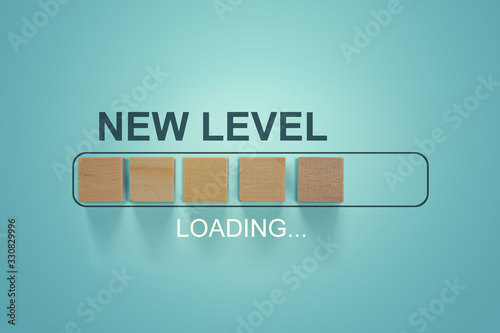 Loading bar progress concept. Next Level text loading almost complete with wooden blocks in progress bar.