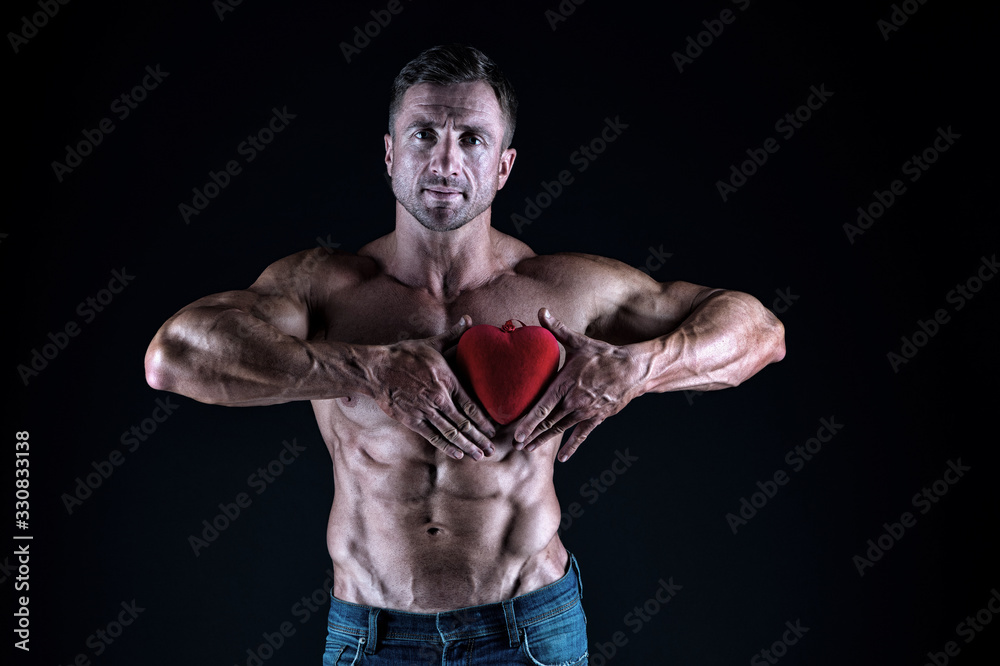 Treat your heart with love. Strong man hold red heart. Giving heart for valentines day. Cardiovascular health. Healthy diet. Heartache and chest pain. Healthcare. Keep your heart healthy