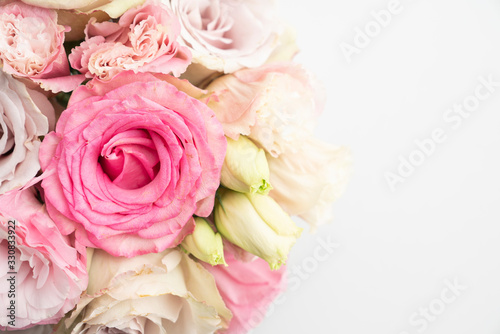 Pink roses and lisianthus flower bridal bouquet floral background