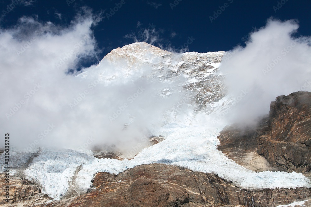 Mount Makalu with clouds, Nepal Himalayas mountains