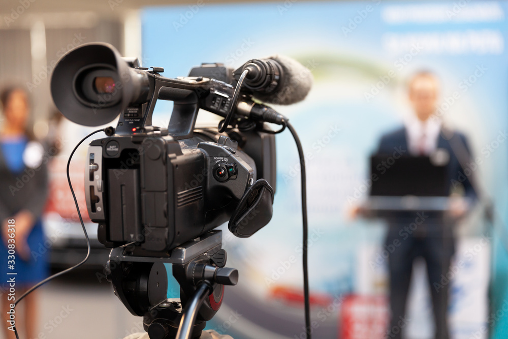 Filming an media event with a video camera. News conference. Filming an media event with a video camera. News conference.