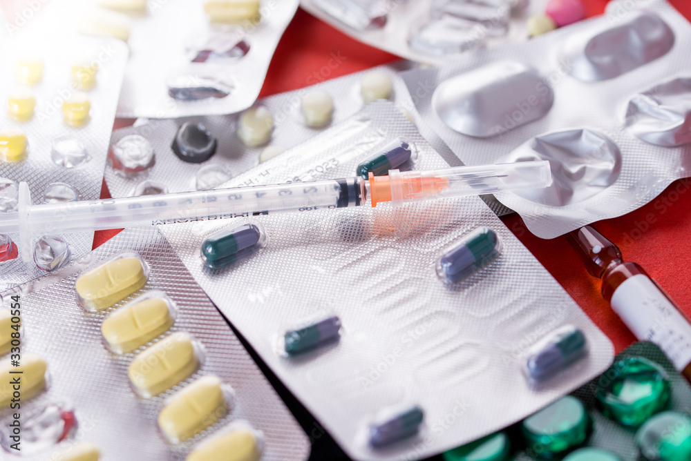 Drugs against the virus, lots of pills and syringes. Drugs against the virus, lots of pills and syringes.