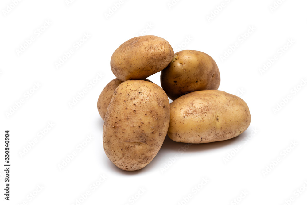 raw dirty potatoes on a white background raw dirty potatoes on a white background