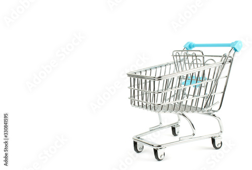 The cart of a supermarket on the white isolate.