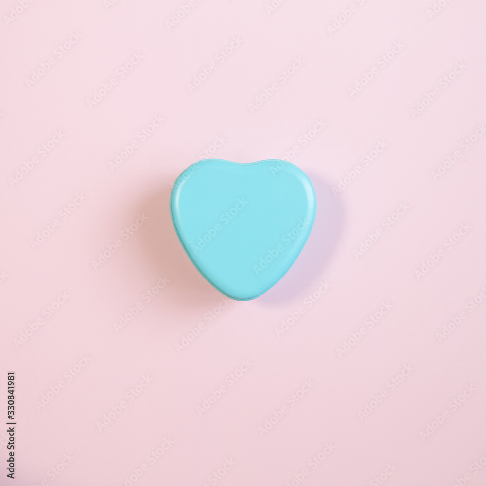 Blue heart shaped box isolated on pink background Blue heart shaped box isolated on pink background