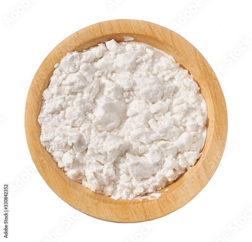 Wooden  plate with potato starch isolated on a white background. Top view.