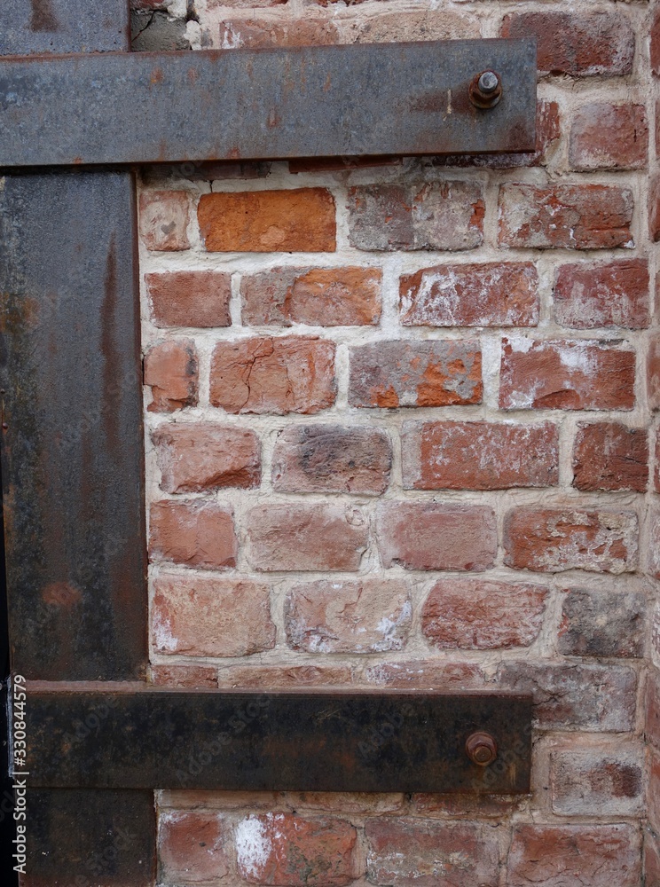 a fragment of a worn old brick wall as a background a fragment of a worn old brick wall as a background