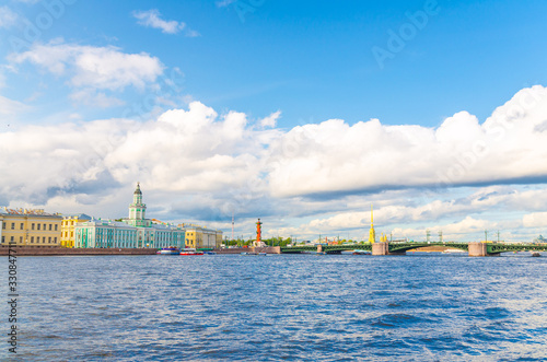 Cityscape of Saint Petersburg (Leningrad) city with Palace Bridge (bascule bridge) across Neva river, Kunstkamera building, Rostral Columns on Strelka Arrow of Vasilyevsky Island, Russia photo