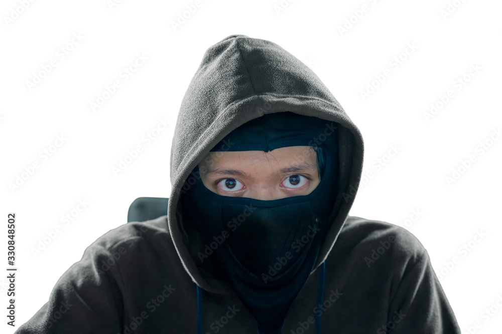 Masked hacker looking at camera in studio Masked hacker looking at camera in studio