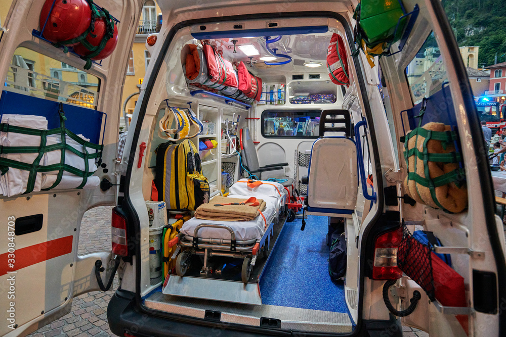 Emergency medical service, View inside the ambulance and the sanitary compartment. Various medical equipment and a tray. Selective focus