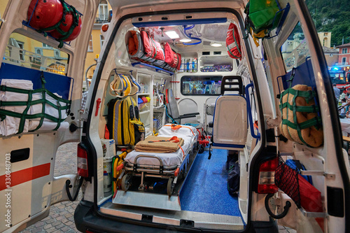 Emergency medical service, View inside the ambulance and the sanitary compartment. Various medical equipment and a tray. Selective focus