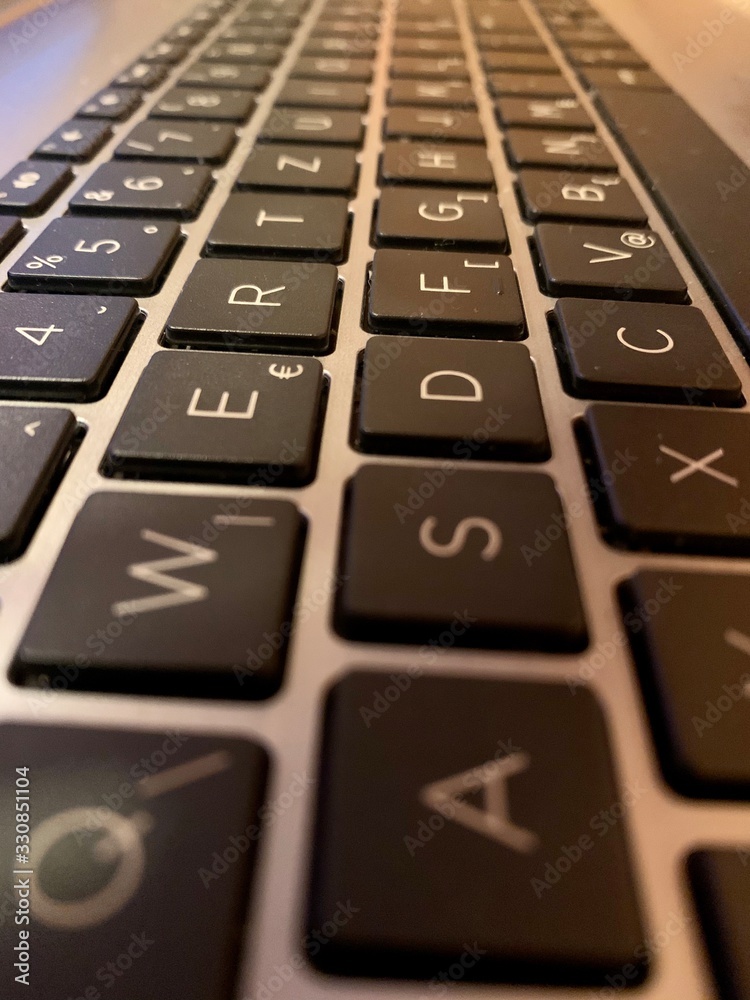 closeup of keyboard — keyboard buttons getting smaller and farther closeup of keyboard — keyboard buttons getting smaller and farther