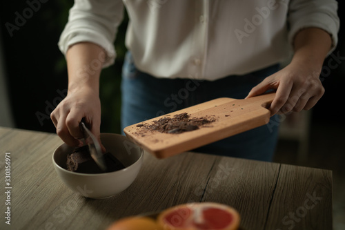 shot of woman cutting chocolate