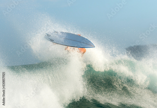 Surfer riding a large wave, SydneyAustralia photo