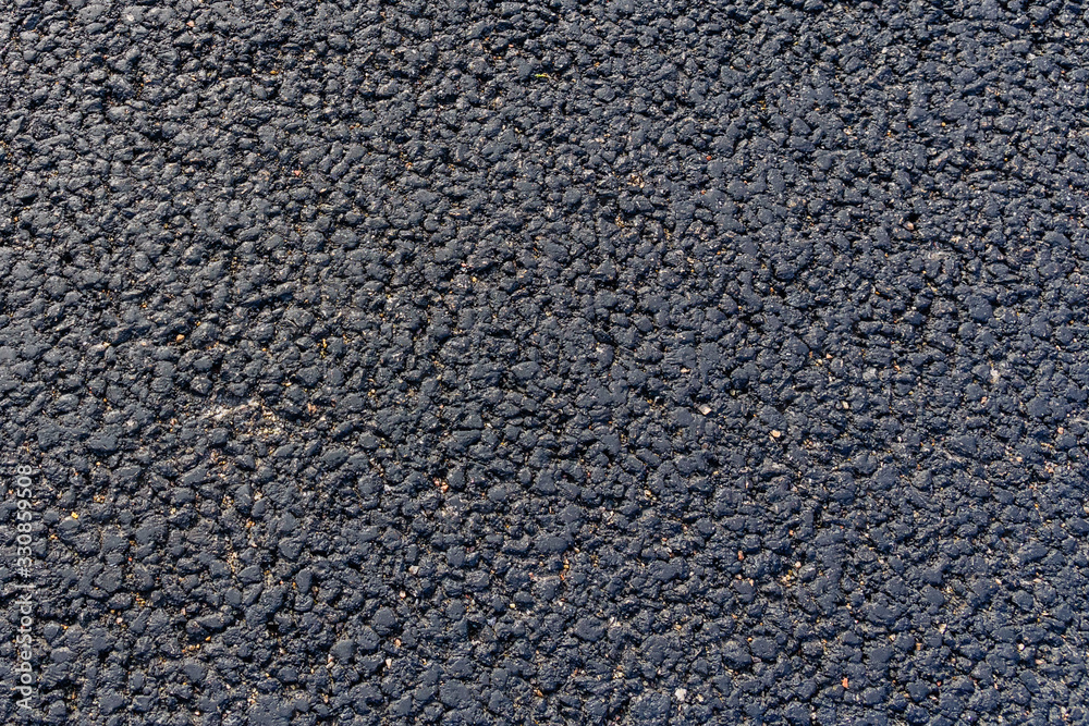 Texture of the new asphalt road for background Texture of the new asphalt road for background